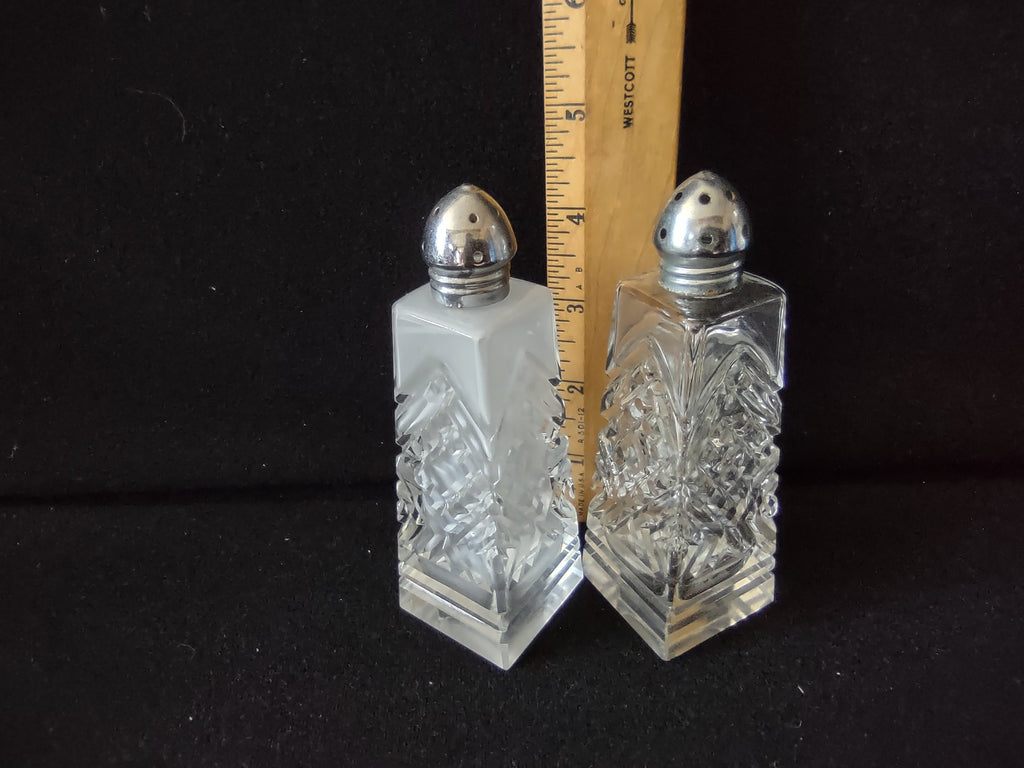 Top view of vintage pressed glass salt shaker with silver dome lid showing dispensing holes