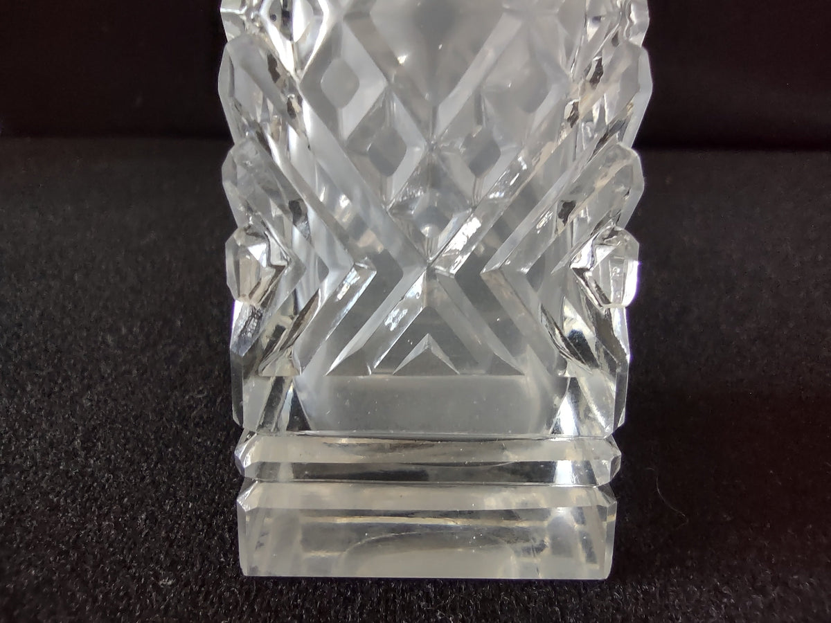 Side view of mismatched vintage pressed glass salt and pepper shaker pair
