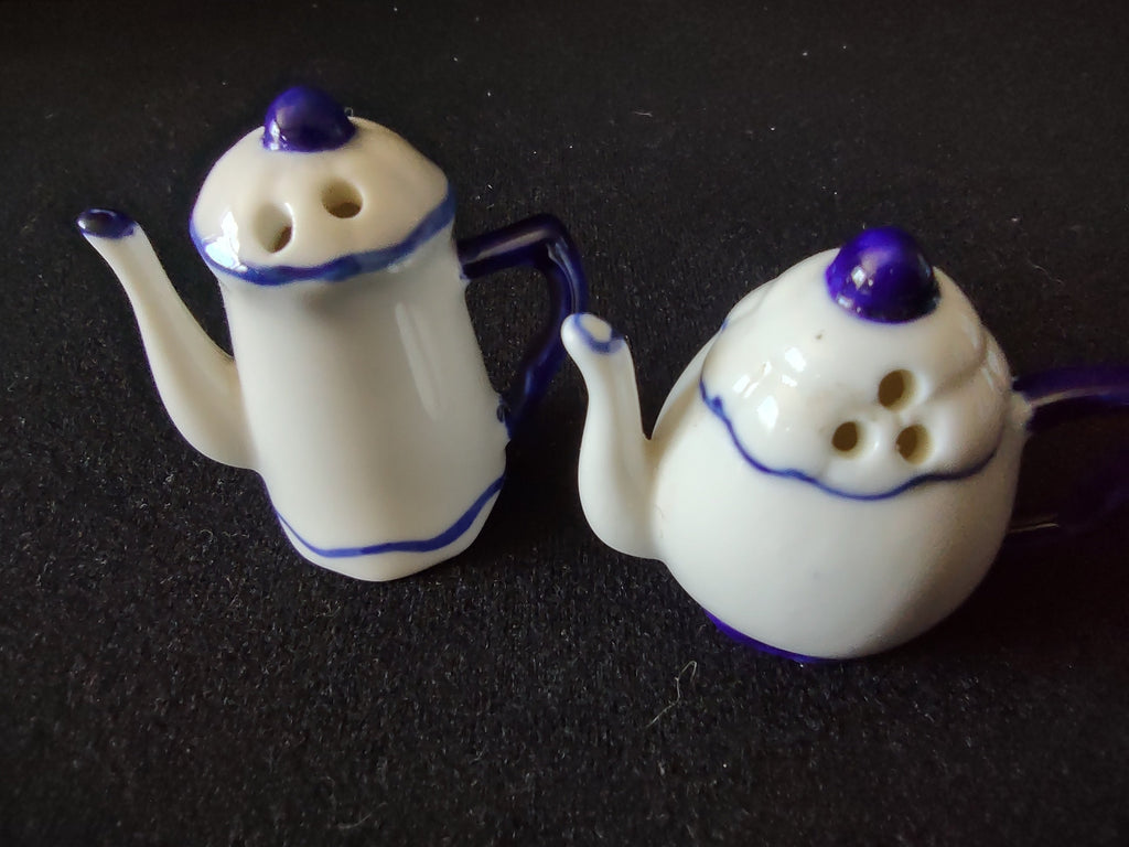 Vintage ceramic teapot salt and pepper shakers blue and off-white top view showing shaker holes