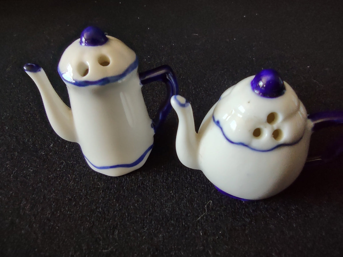 Vintage ceramic teapot salt and pepper shakers blue and off-white top view showing shaker holes