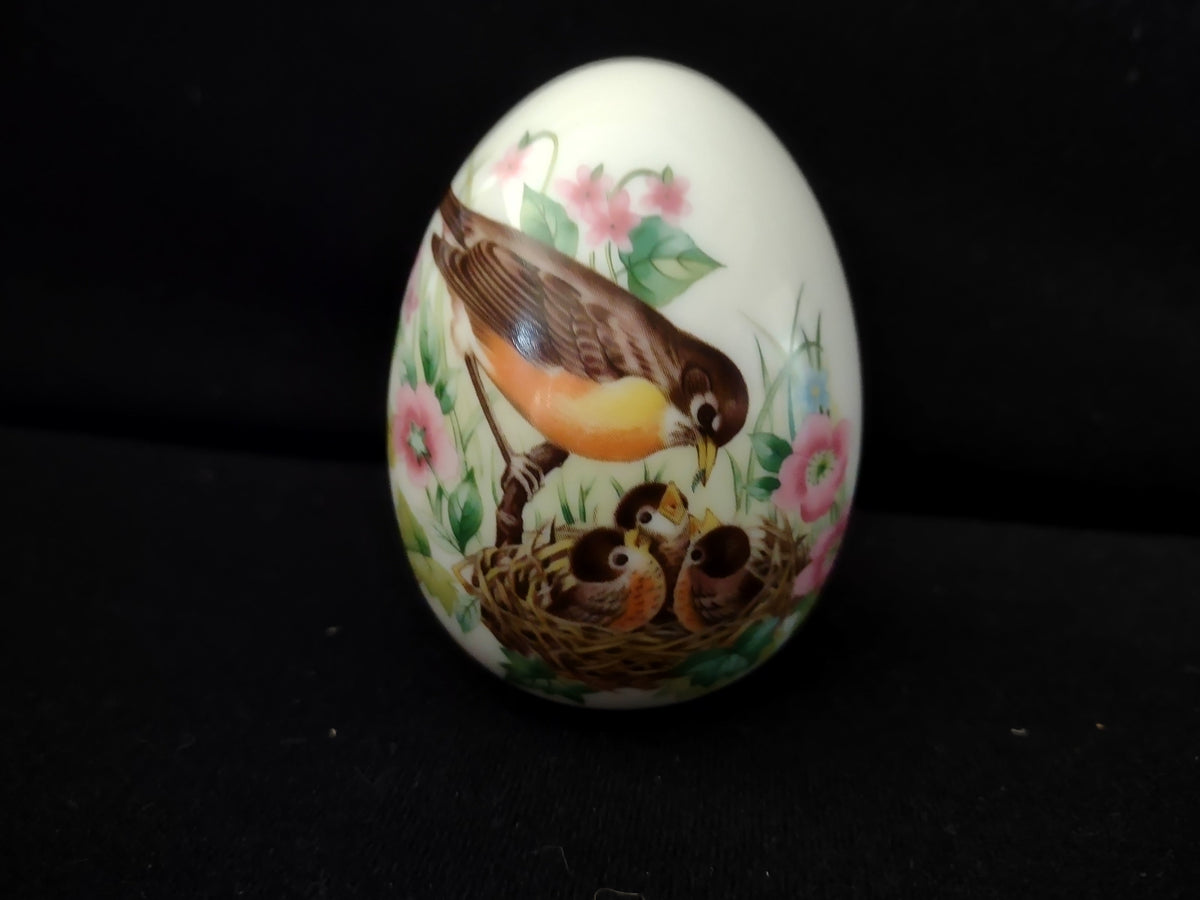 Avon Collectibles porcelain egg with ruler showing approximately 3 inches tall