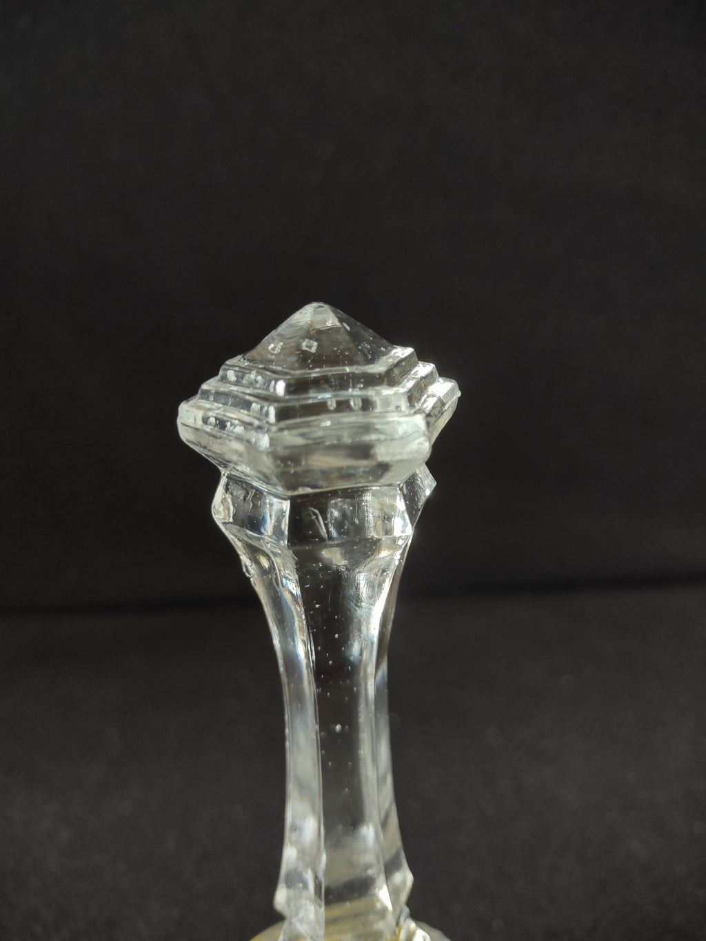 Close-up of cut crystal base with hand-painted yellow songbird and green foliage enamel decoration