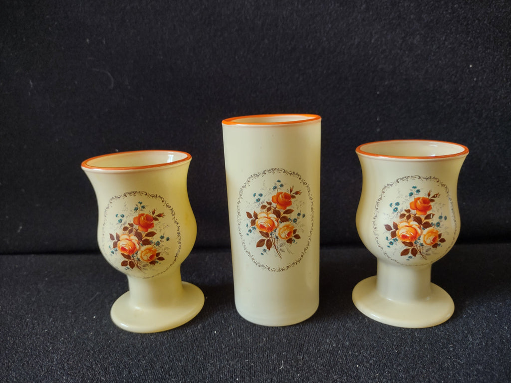 Vintage frosted glass cylindrical vase with orange rose medallion, ruler showing ~5 inch height