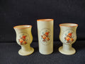 Vintage frosted glass cylindrical vase with orange rose medallion, ruler showing ~5 inch height
