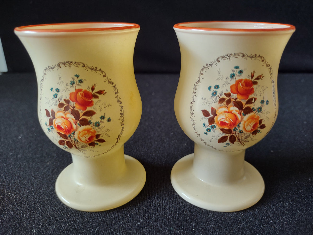 Top-down view of two frosted glass goblets showing off-white interior