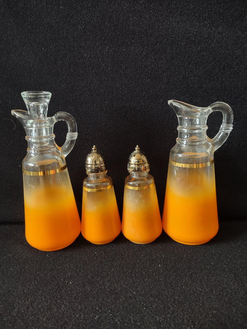 4-piece orange frosted glass condiment set with gold band - full set view