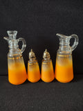 4-piece orange frosted glass condiment set with gold band - full set view