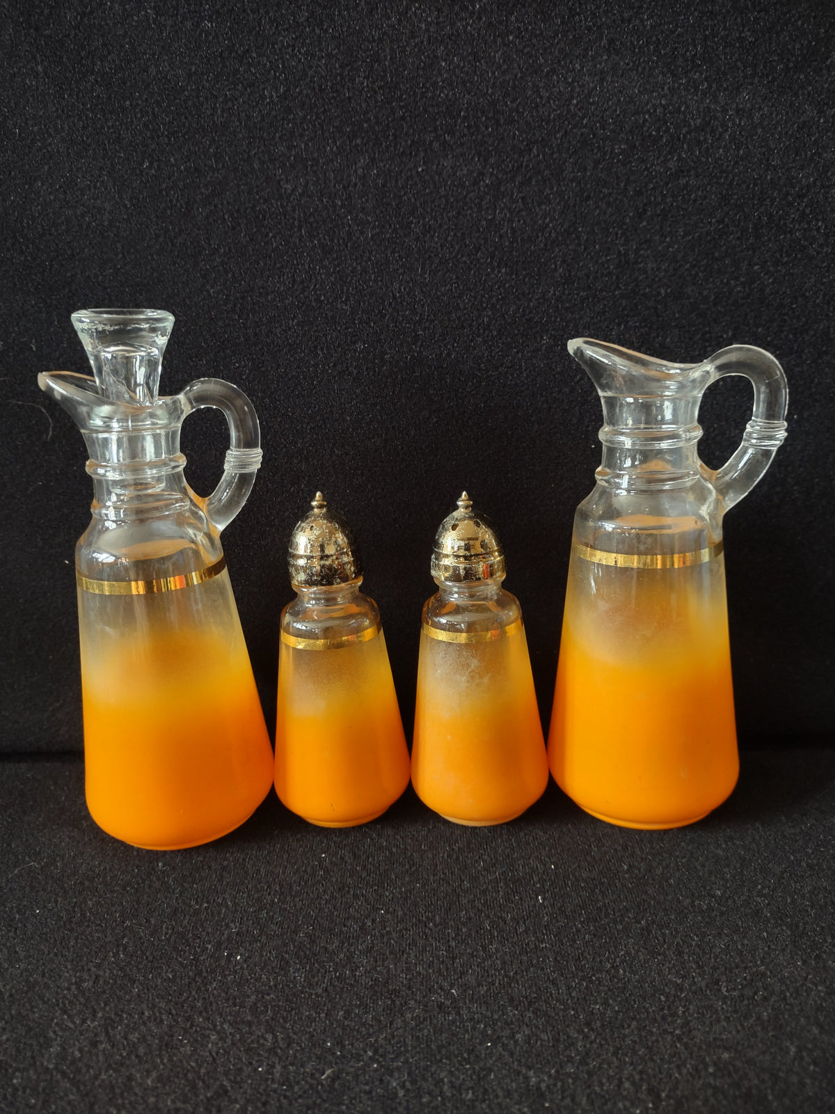 4-piece orange frosted glass condiment set with gold band - full set view