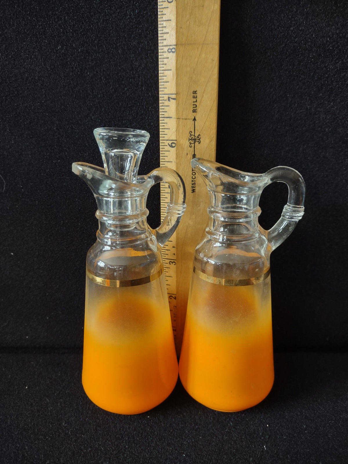 Orange frosted glass cruet set group shot showing gradient and gold band