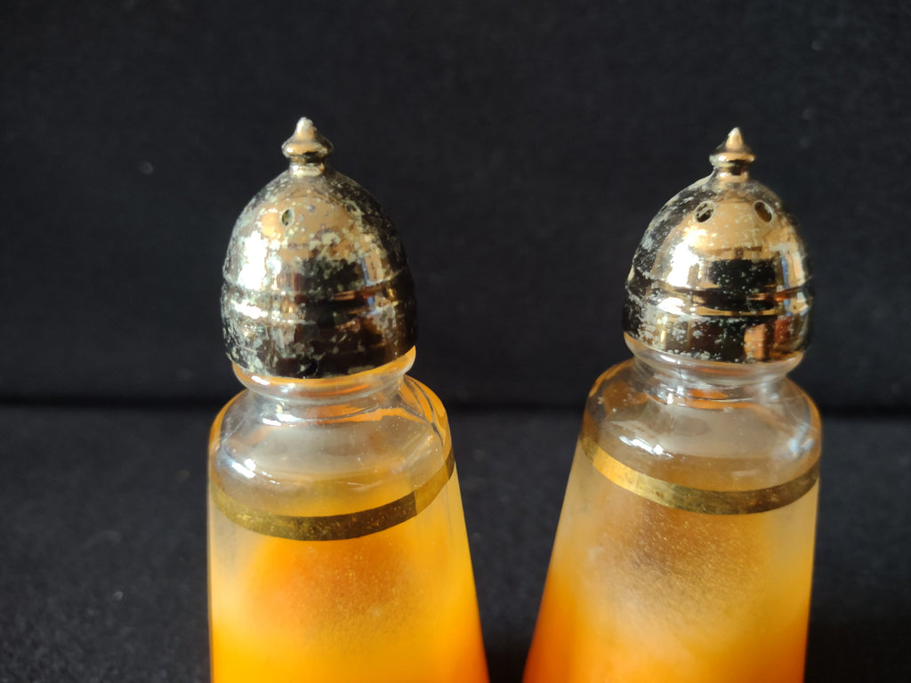 Cruets from above showing glass stoppers and handles
