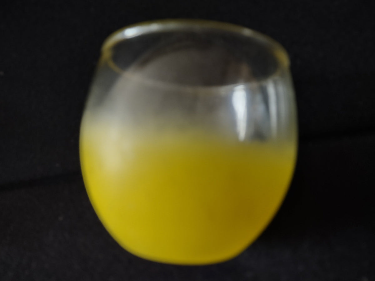 Vintage yellow frosted roly-poly tumbler side view with ruler showing 2.5 inch height