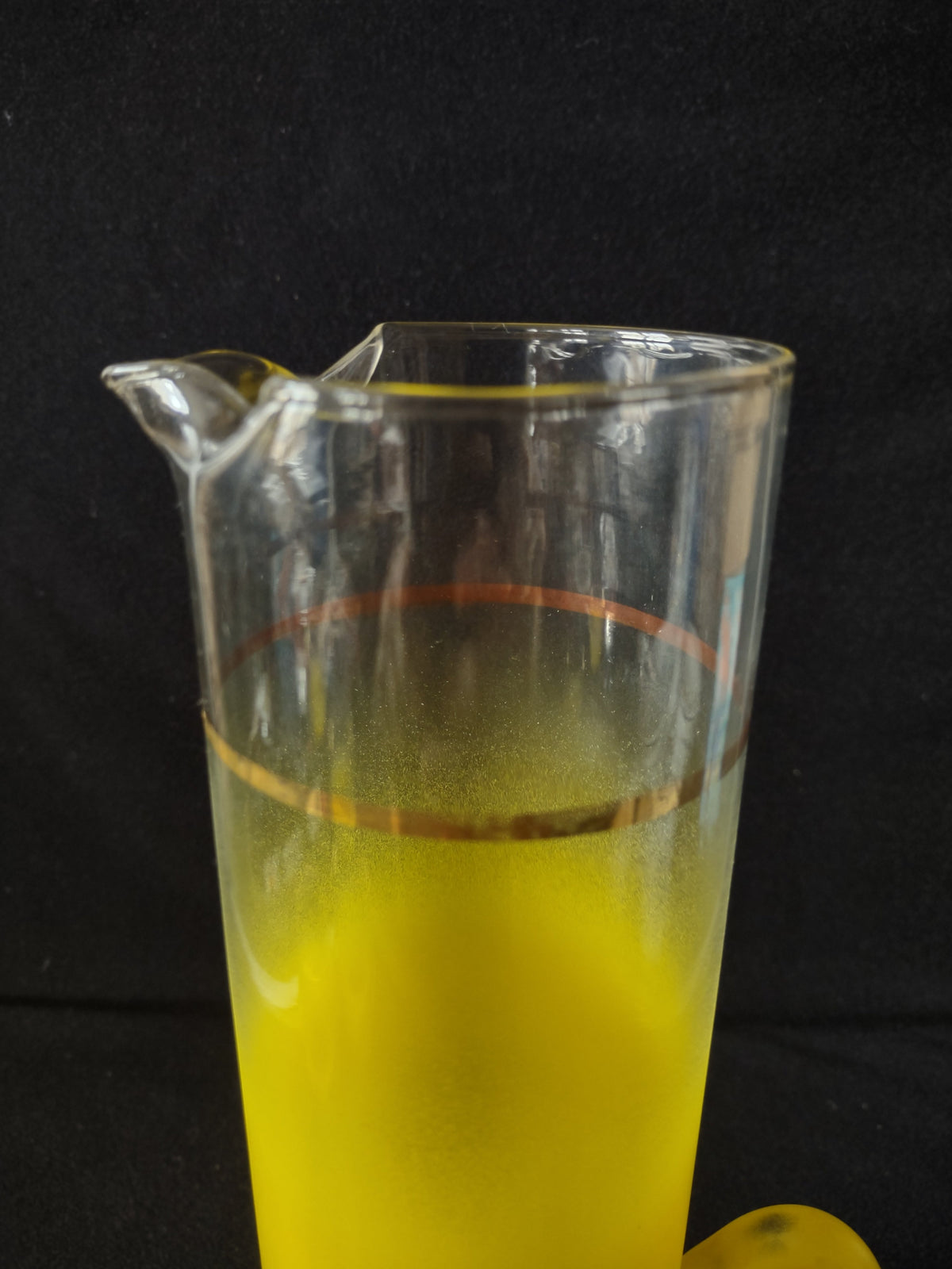 Vintage yellow frosted roly-poly tumbler bottom view showing rounded base