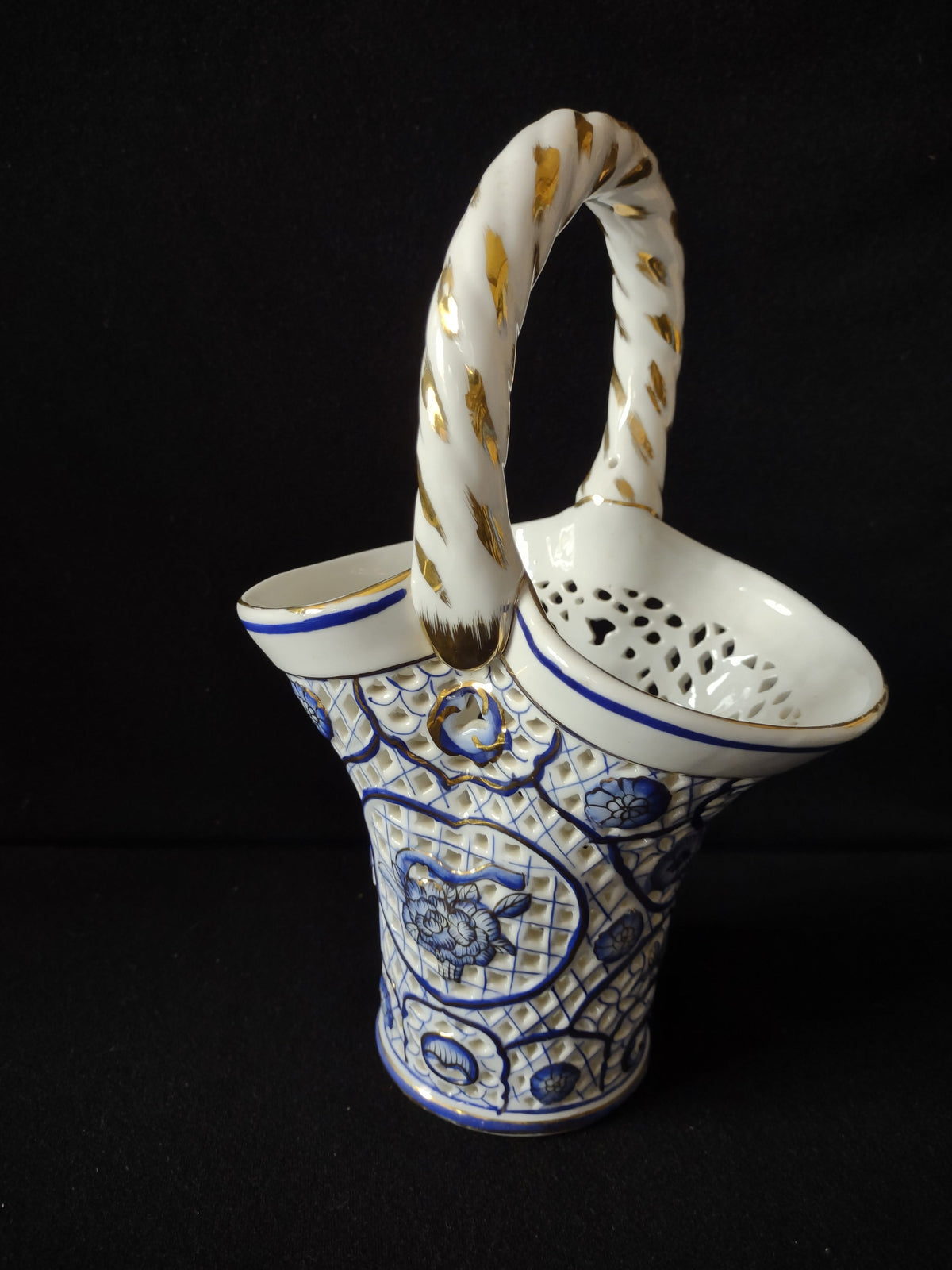 Vintage Hand Painted Fine Porcelain Blue Gold Reticulated Basket - front view showing blue floral motifs and gold twisted rope handle