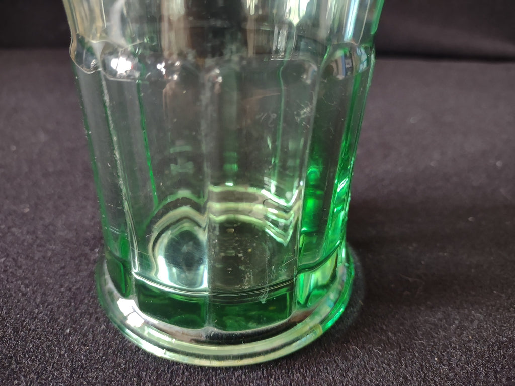 Vintage Coca-Cola green glass tumbler - close-up of stepped base showing mineral deposits