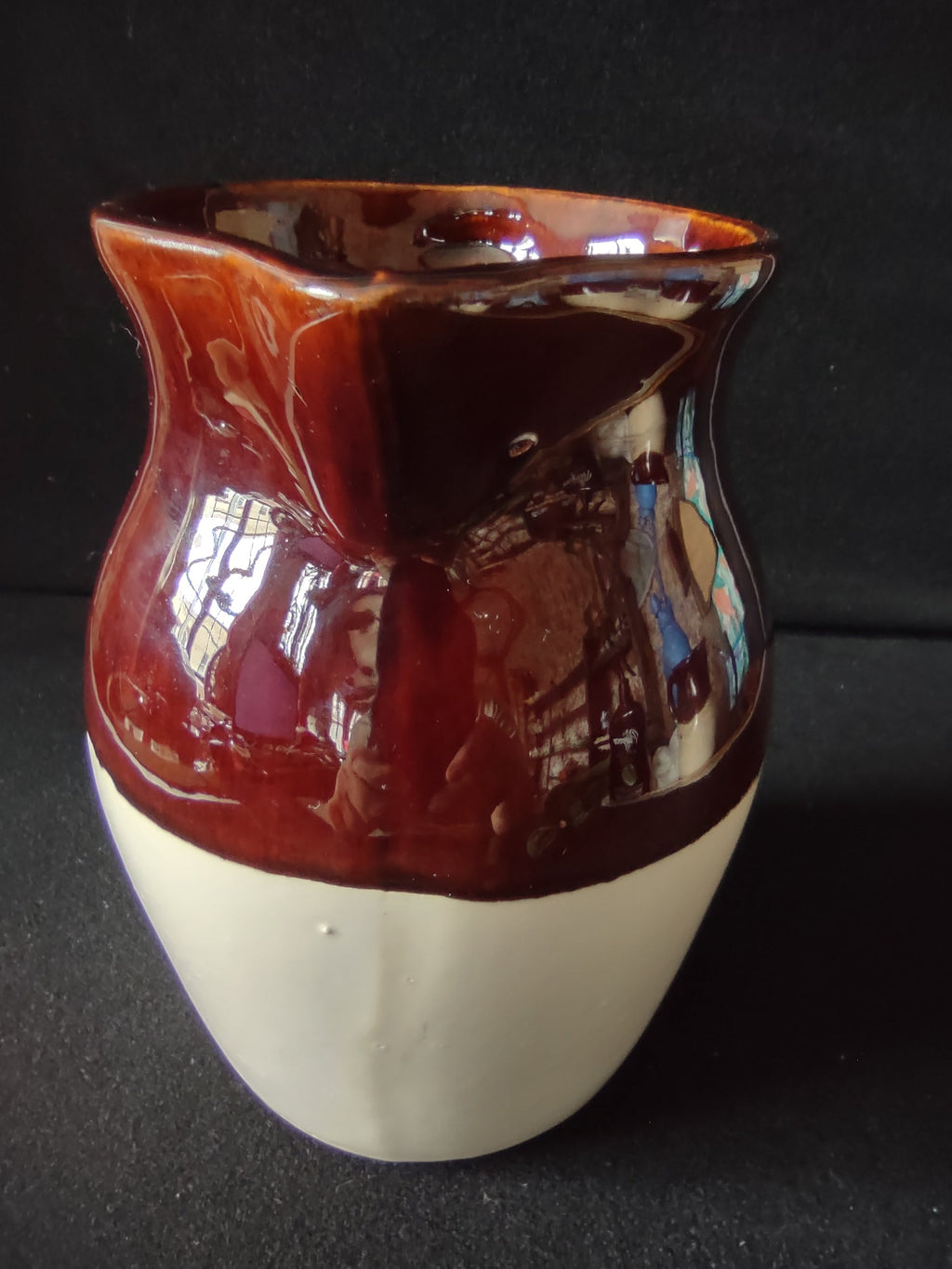 Stoneware pitcher with ruler showing approximately 7 inch height
