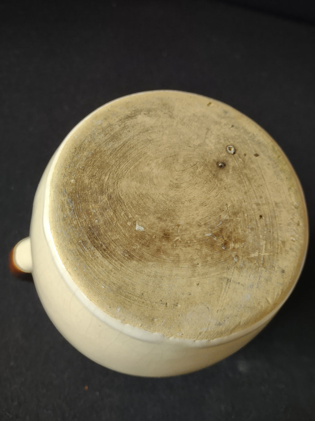 Additional view of vintage stoneware pitcher showing two-tone glaze detail