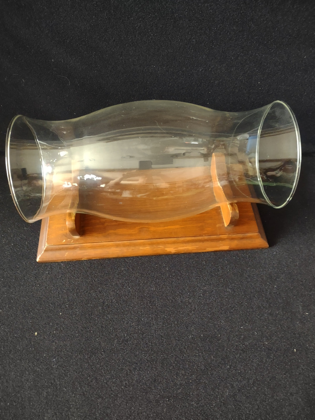 Top view of wood cradle stand showing two curved saddle supports
