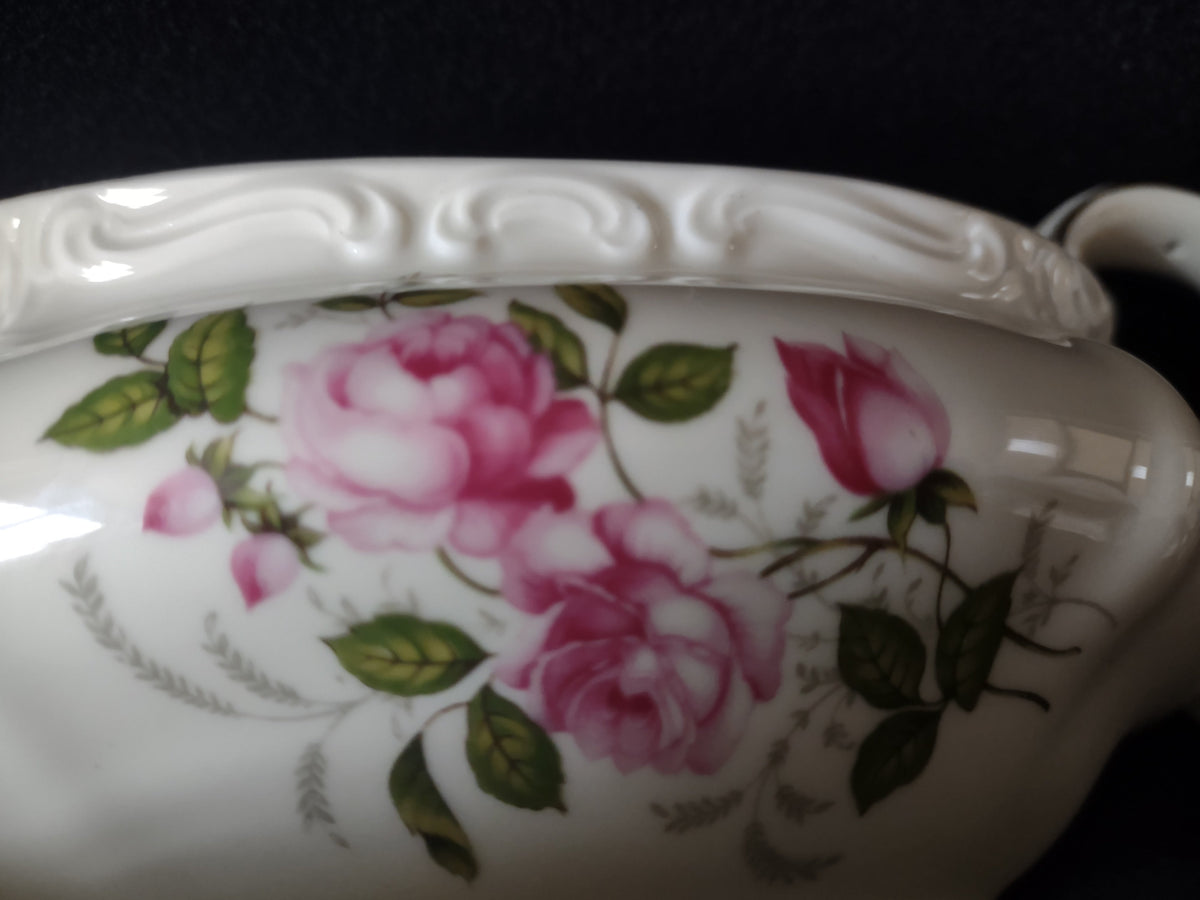 Rosenthal Pompadour underplate with pink rose motif and gold edge