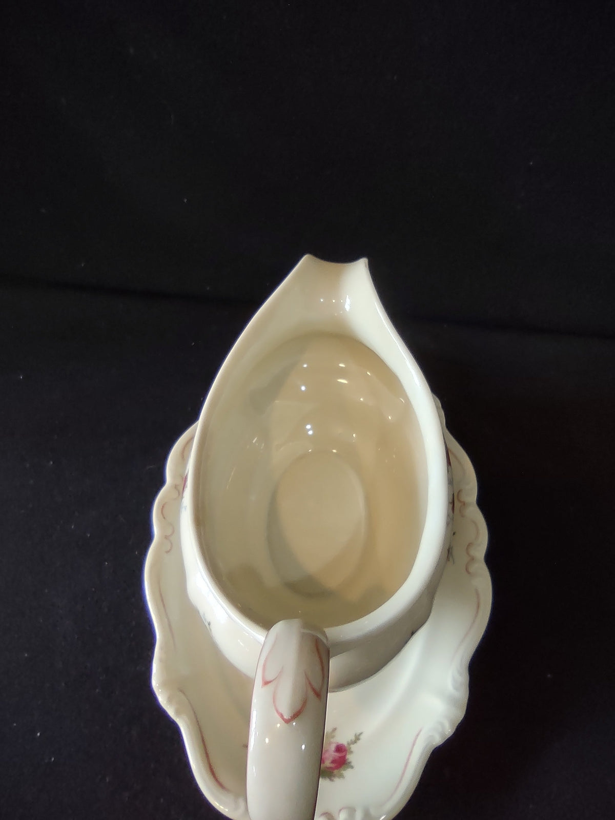 Vintage rosebud gravy boat - interior discoloration detail