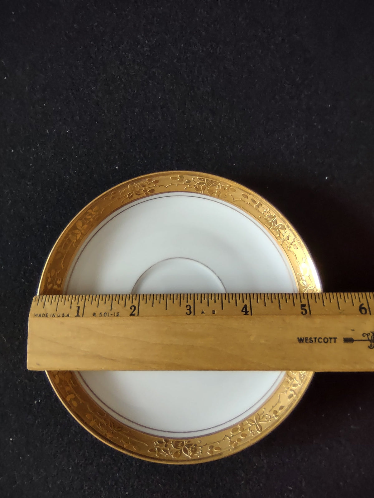 Front view of saucer on display stand