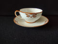 Saucer detail with orange motif