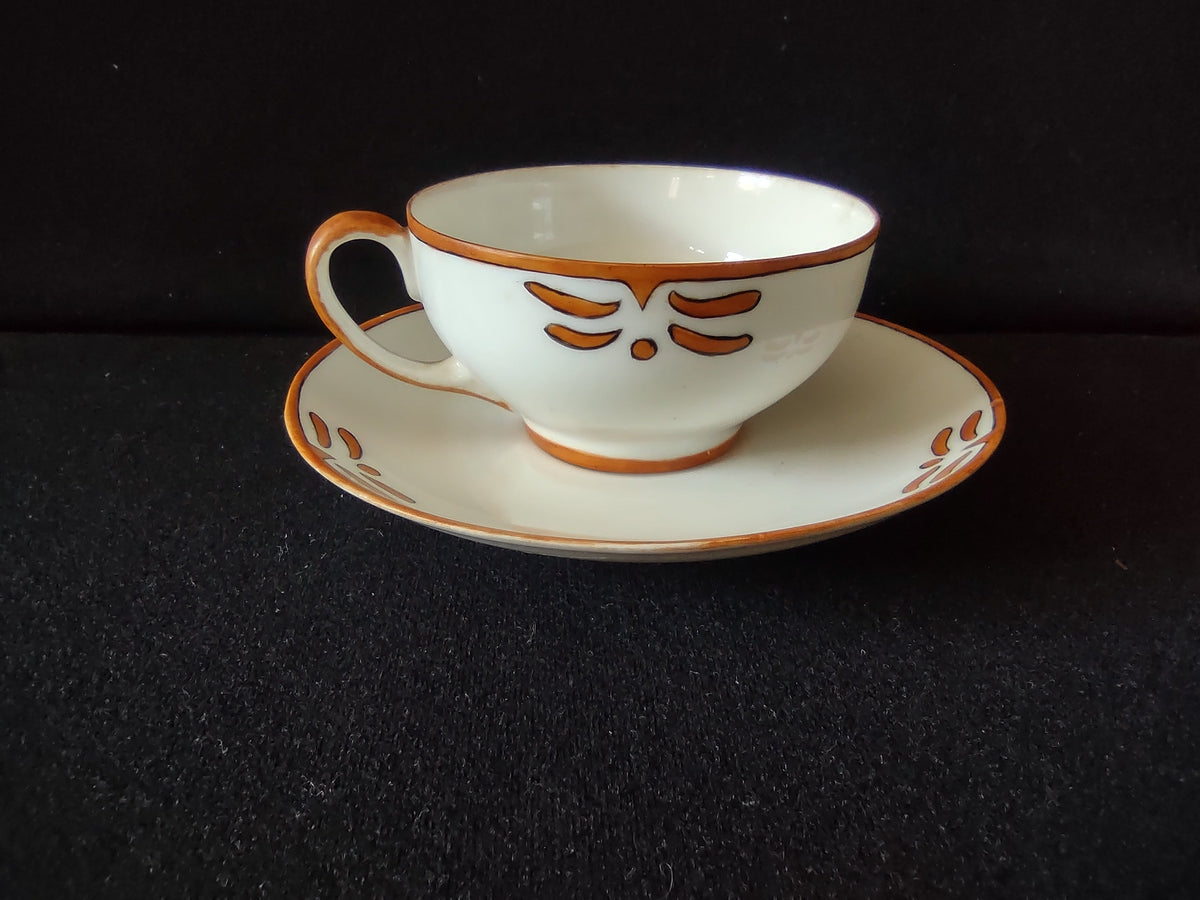 Saucer detail with orange motif