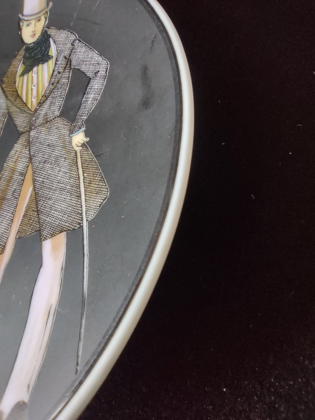 Side angle showing scratches on black ground surface
