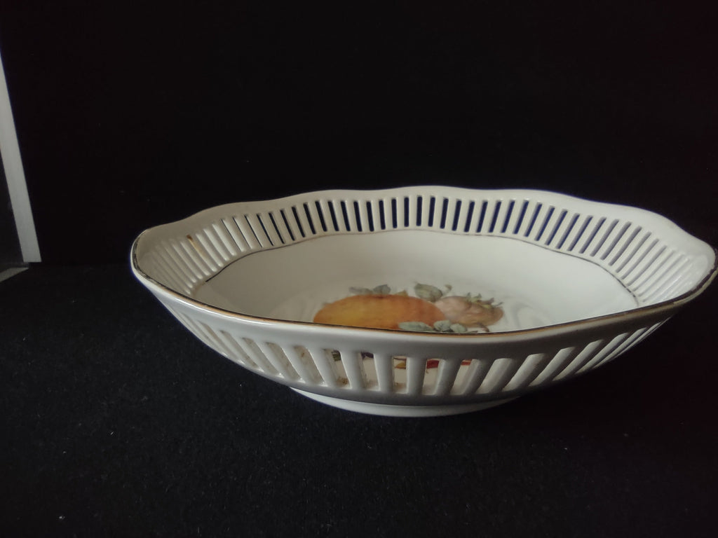 Winterling reticulated fruit bowl - close-up of lattice rim showing gold trim and openings