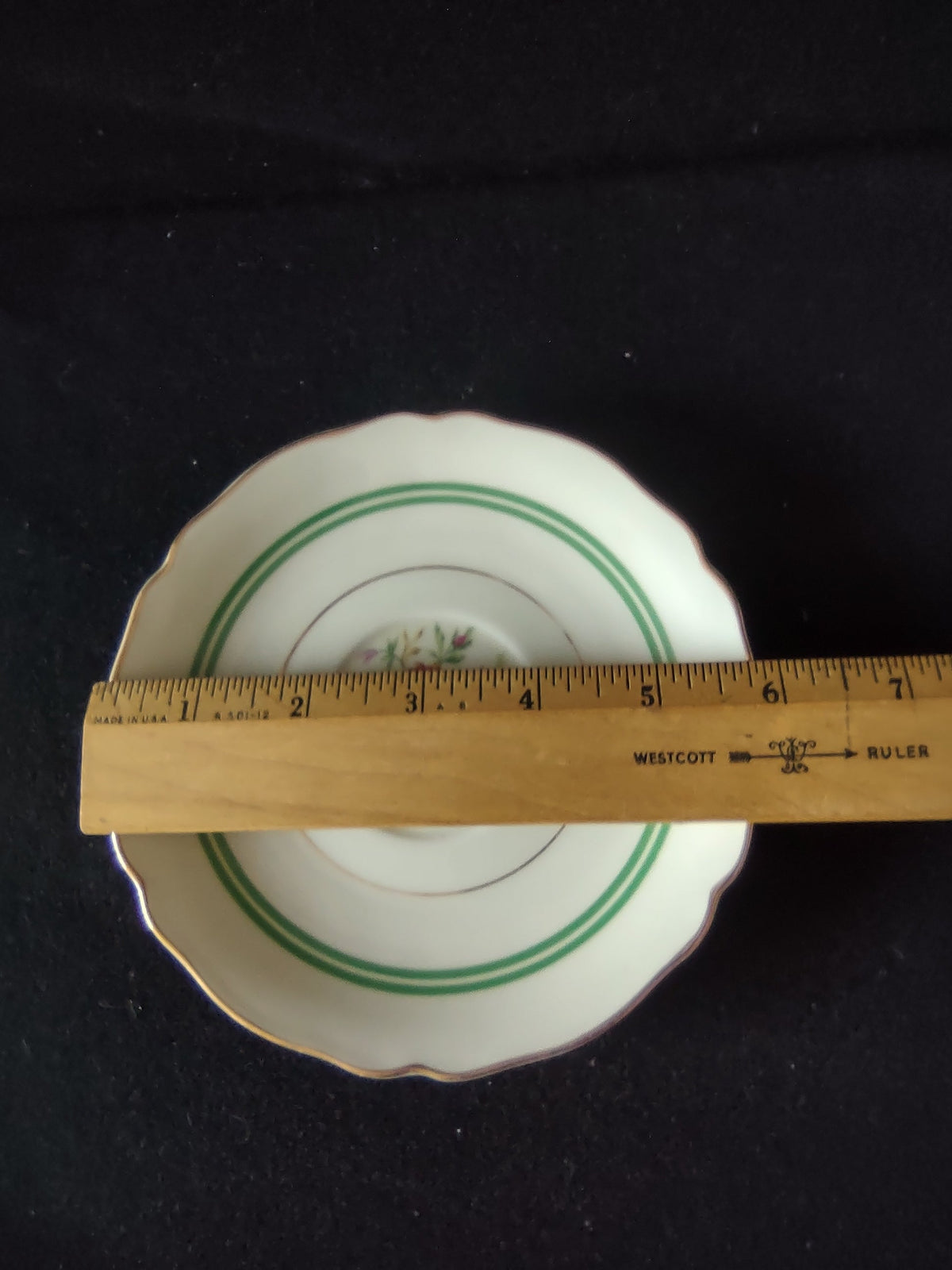 Hutschenreuther Murillo saucer - angled view showing depth and banding