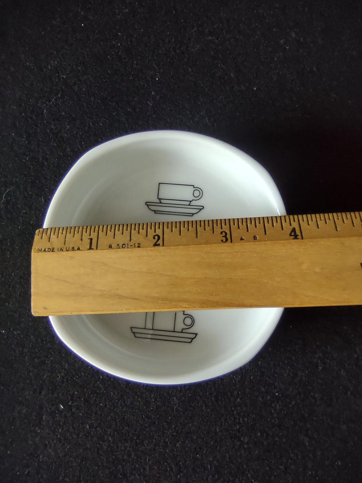 Rosenthal Studio-Linie display bowl - interior view showing black line-art dinnerware silhouettes