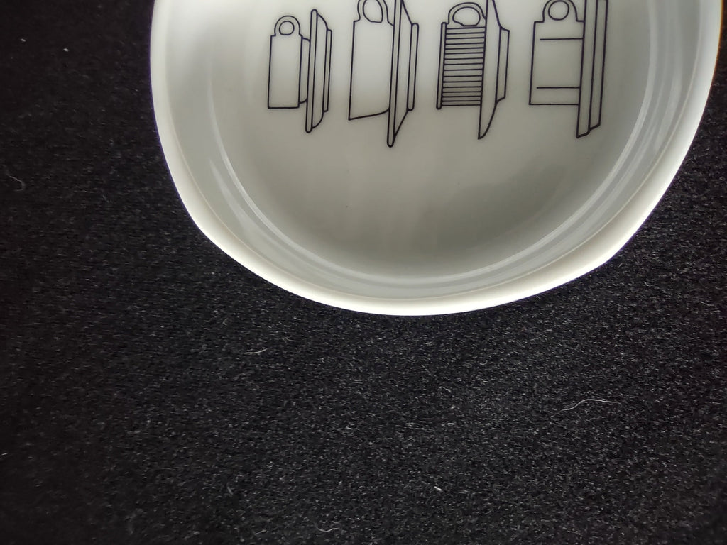 Rosenthal Studio-Linie display bowl - close-up of interior line-art showing stacked dinnerware illustrations