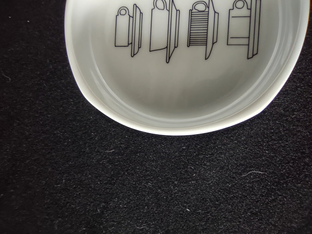Rosenthal Studio-Linie display bowl - close-up of interior line-art showing stacked dinnerware illustrations