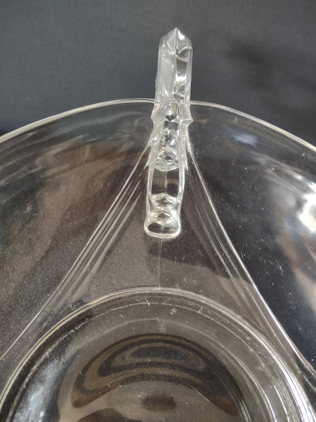 Angled view showing full profile of relish dish with wing handles extended