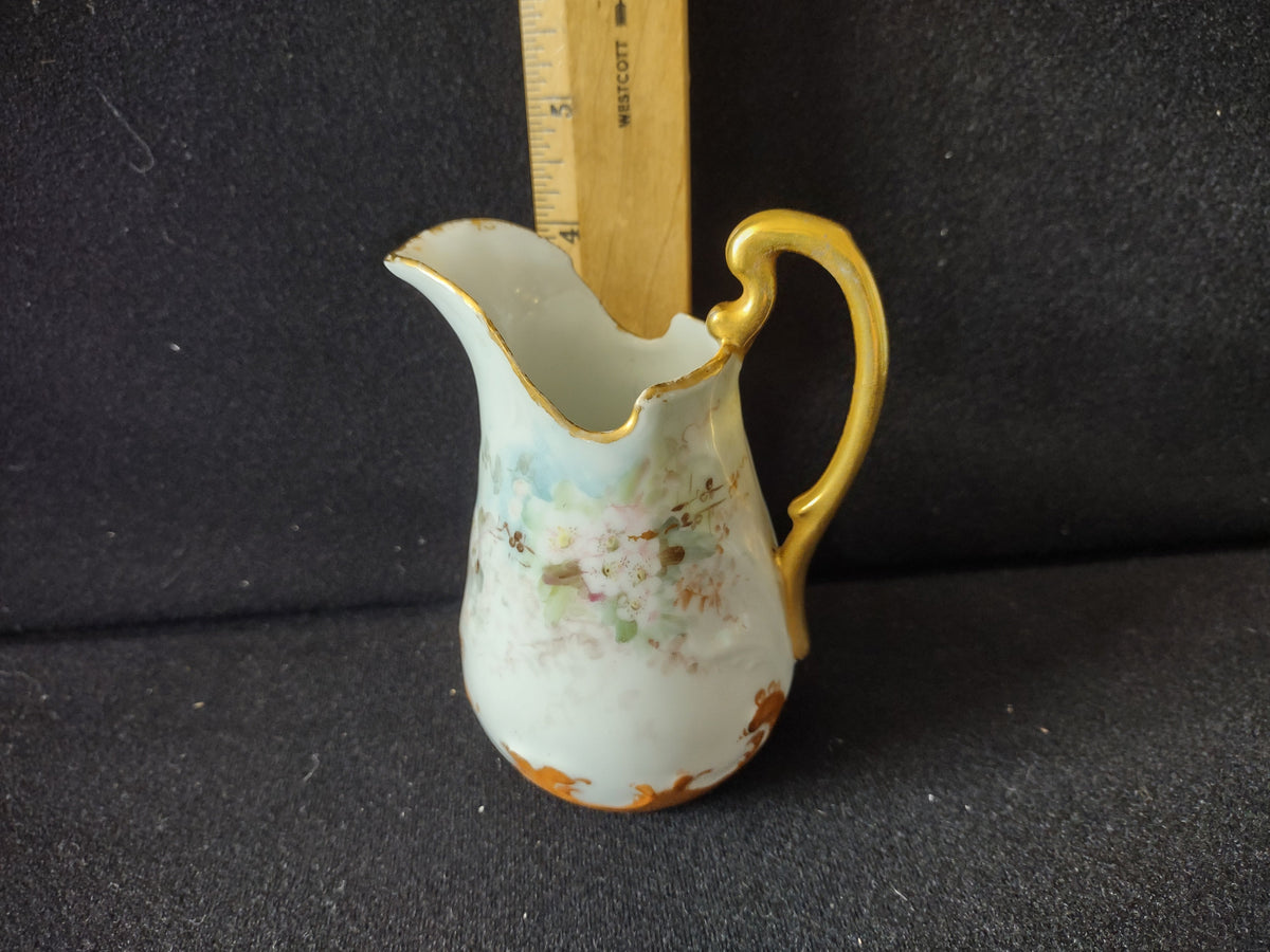 Miniature porcelain creamer - bottom view showing unglazed white foot rim with no backstamp