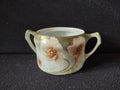 Vintage porcelain pink wild rose two handle sugar bowl - front view showing full rose decoration