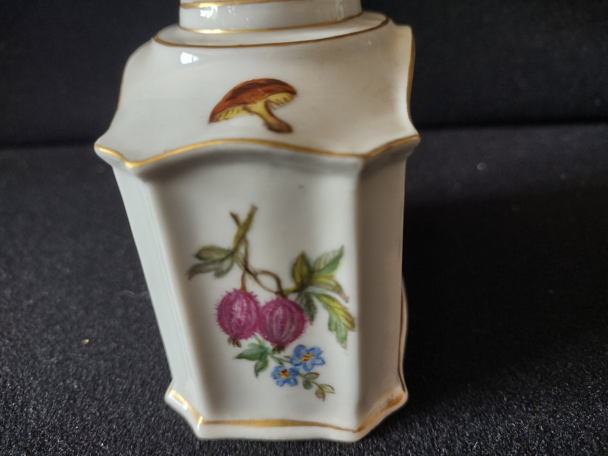Tea caddy angled view showing overall octagonal form and gold base border