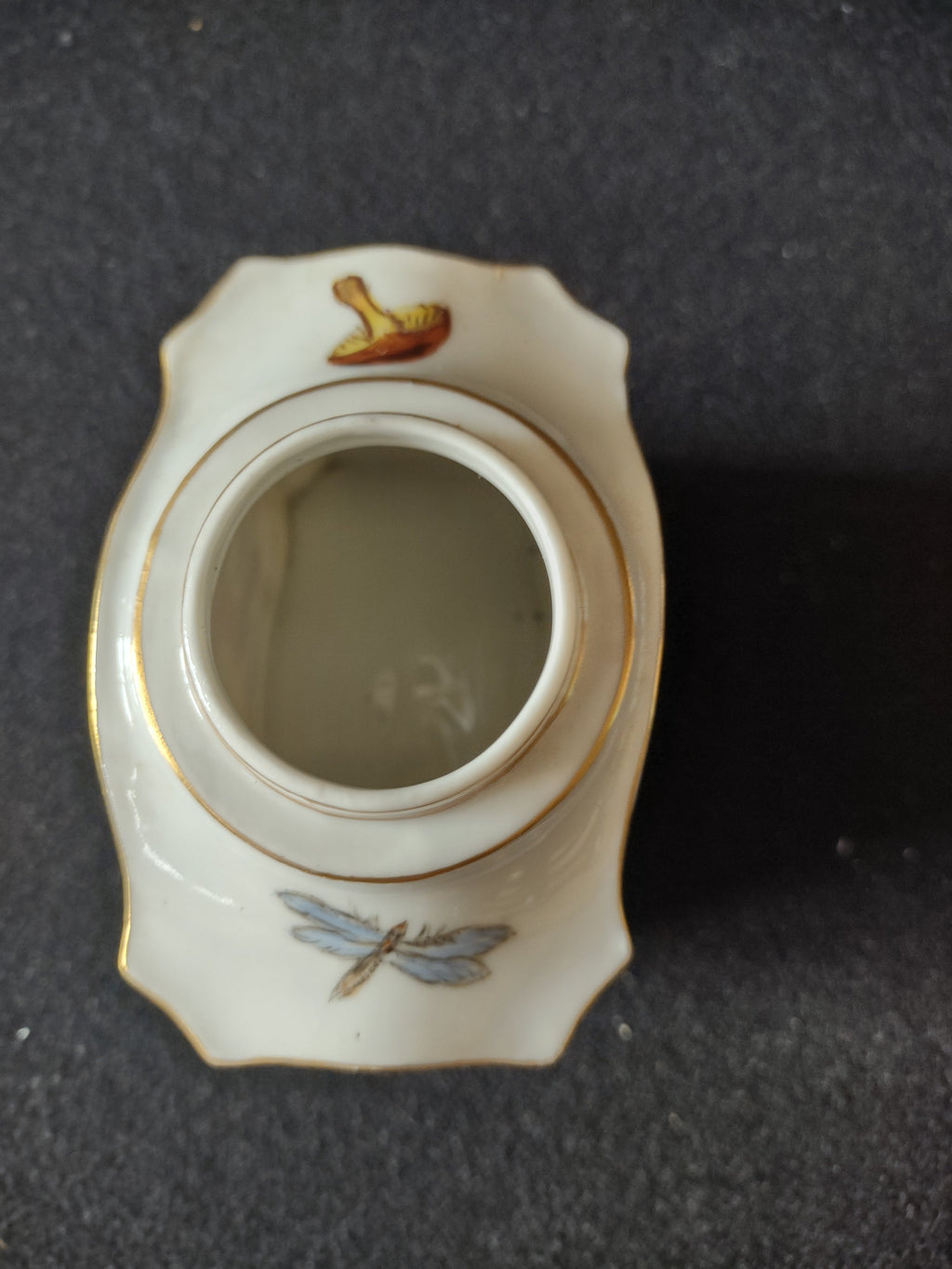 Close-up of stepped cylindrical collar neck showing double gold ring bands with WEAR consistent with age