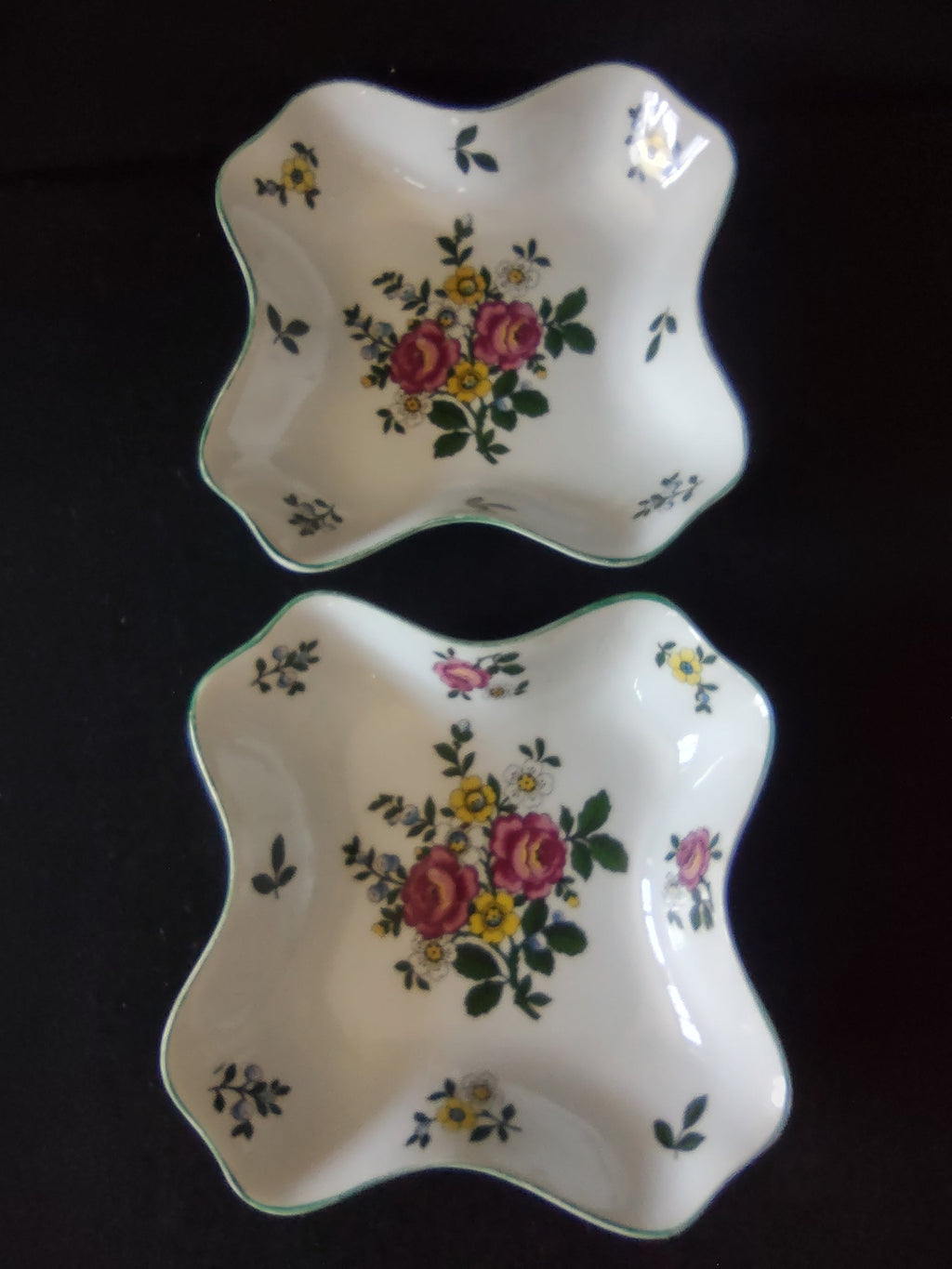 Royal Tettau candy dish interior corner view showing floral bouquet pattern and teal green wavy rim