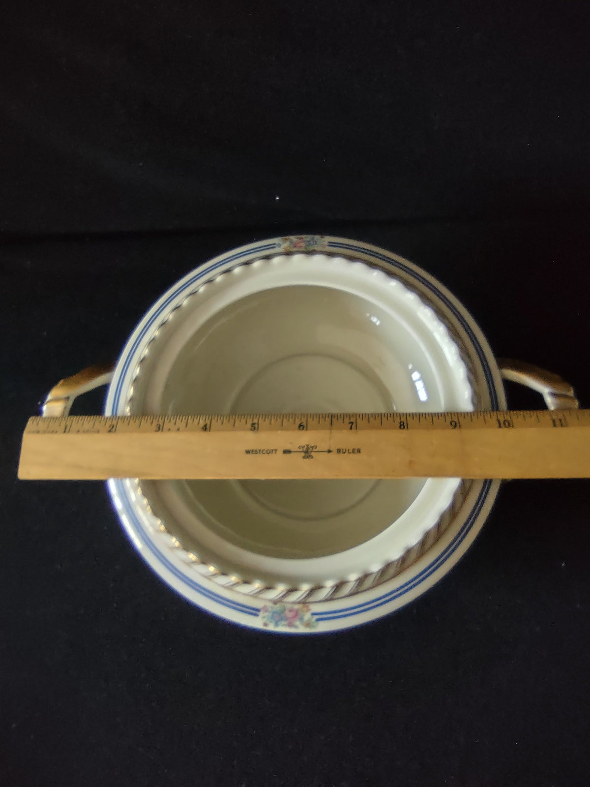 Limoges serving bowl lid side edge view showing double cobalt blue bands gold outer rim line and hand-painted floral pattern