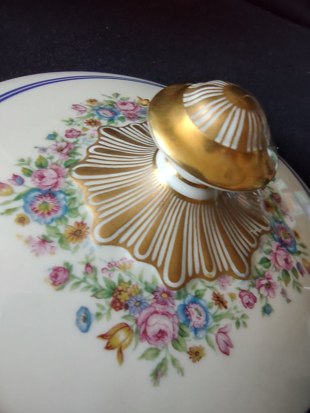 Limoges covered bowl three-quarter view showing assembled bowl and lid with cobalt blue bands and gold floral decoration