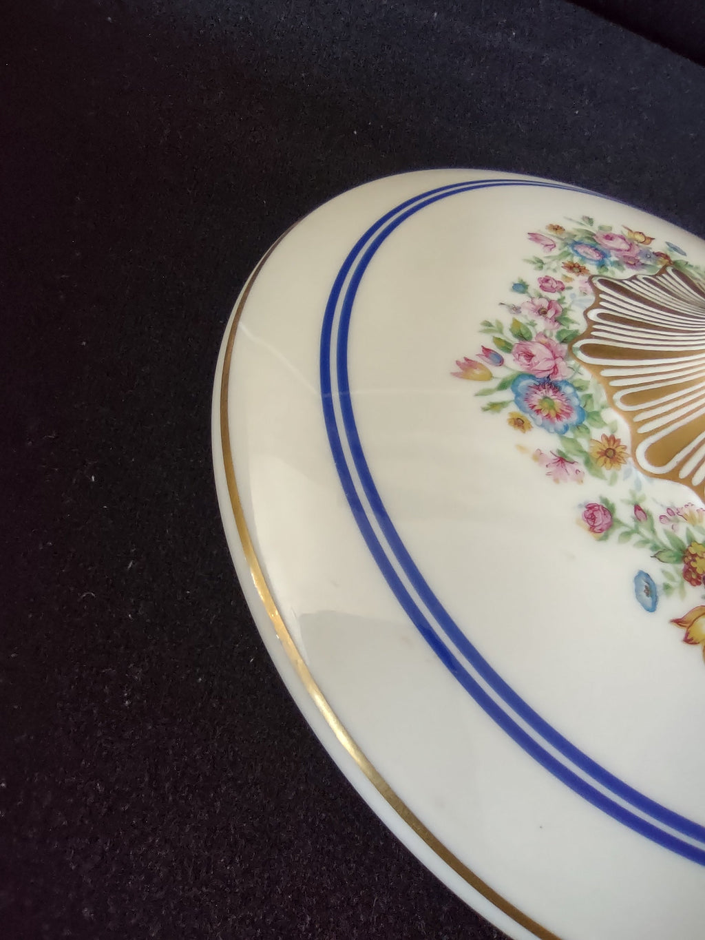 Limoges serving bowl close-up showing gilt handle wear consistent with age and double blue band detail