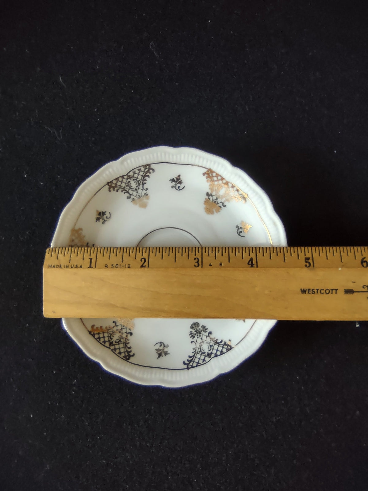 Schumann Bavaria cup and saucer set assembled view showing black gold chinoiserie pattern and gilt interior from above