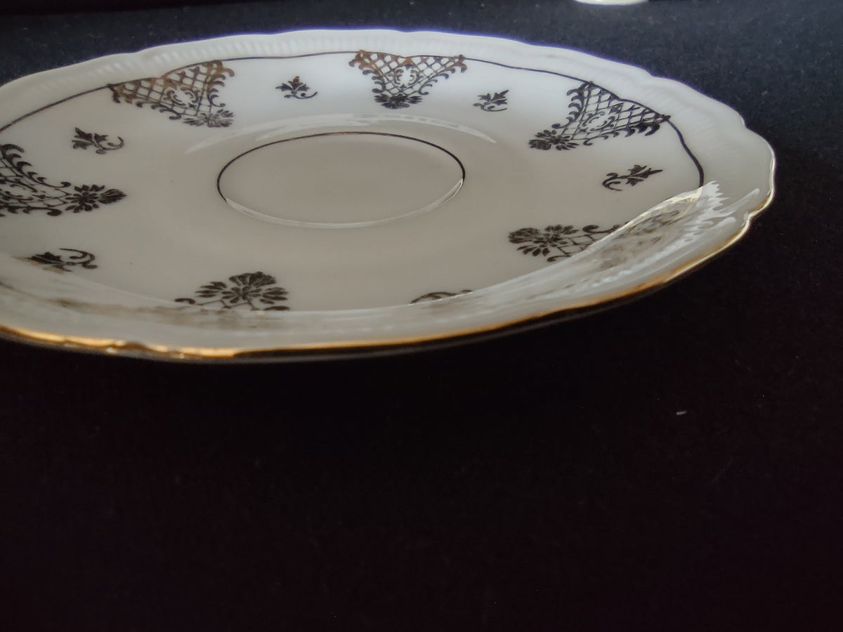 Schumann Bavaria cup and saucer overall view showing complete set with black gold lattice pattern and gilt interior cup