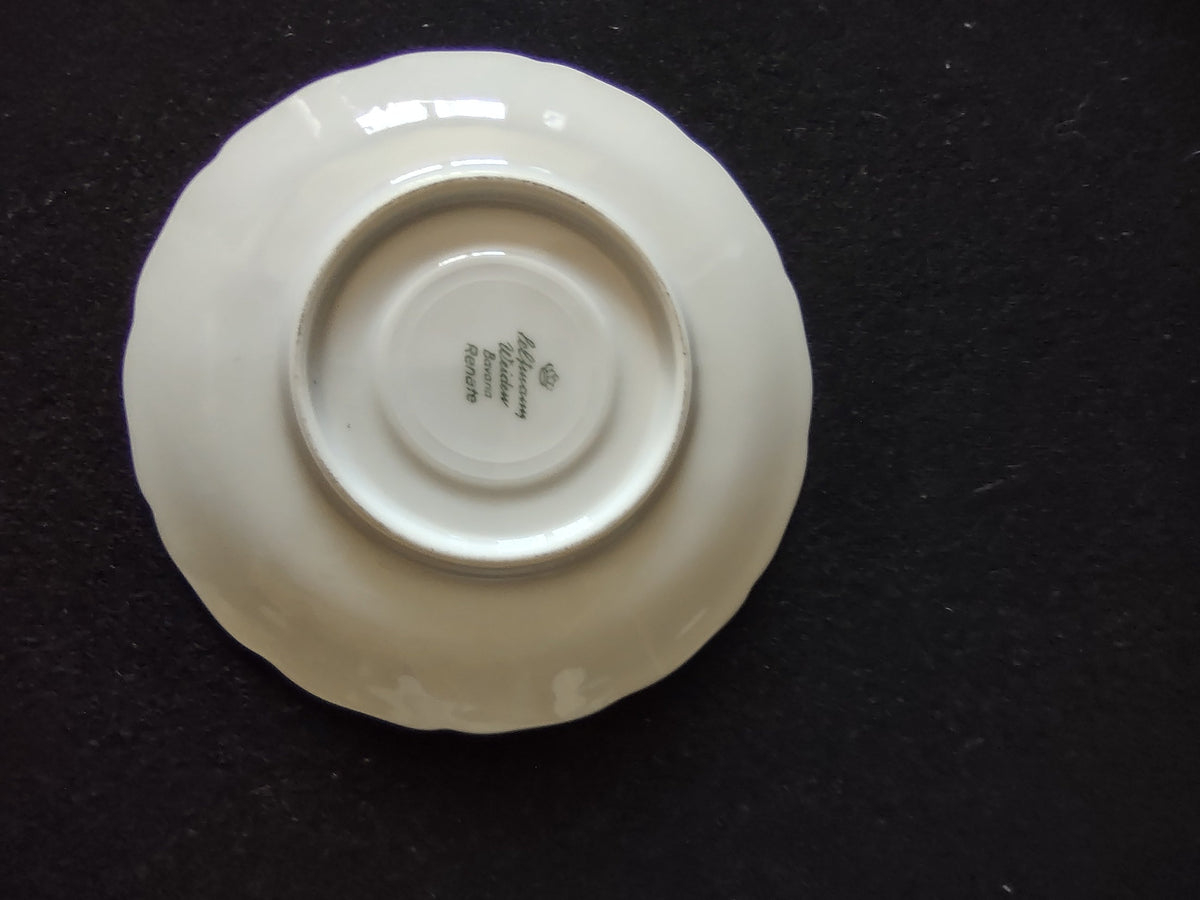Schumann Bavaria cup close-up showing scrolled gold handle detail and black chinoiserie pattern on white porcelain