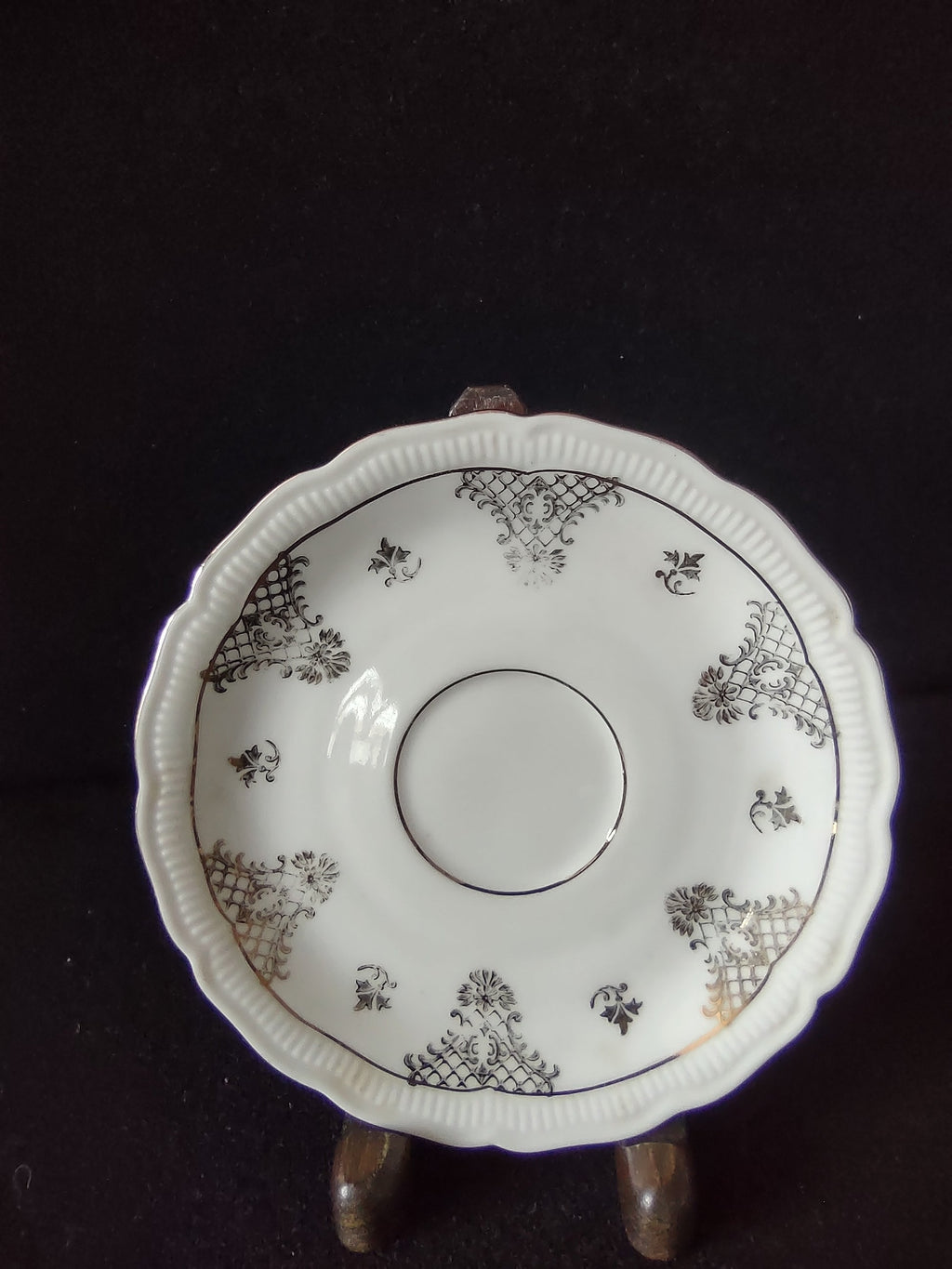 Vintage Seltmann Weiden Bavaria Renate pattern saucer top view showing gold trellis cartouches acanthus scrolls and scalloped gadroon embossed rim
