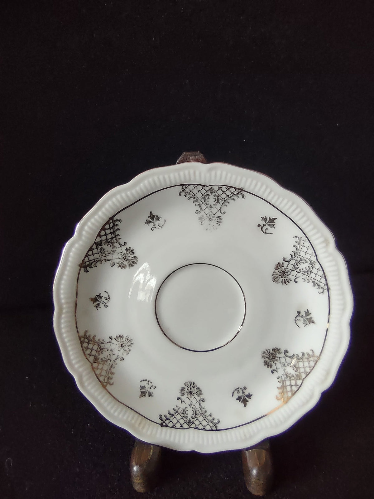 Vintage Seltmann Weiden Bavaria Renate pattern saucer top view showing gold trellis cartouches acanthus scrolls and scalloped gadroon embossed rim