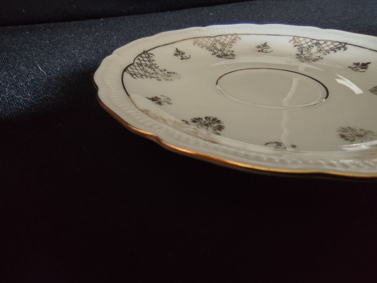Seltmann Weiden Renate saucer side profile view showing scalloped rim gold edge line wear and shallow well