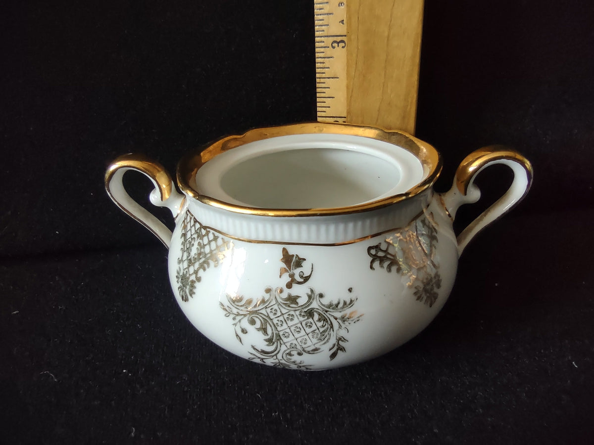 Seltmann Weiden Renate creamer with ruler showing approximately 3 inch height dark background overall view