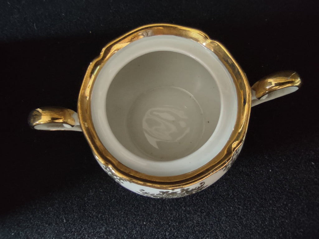 Seltmann Weiden Renate creamer top-down interior view showing scalloped rim gold edge line and chinoiserie trellis pattern on shoulder