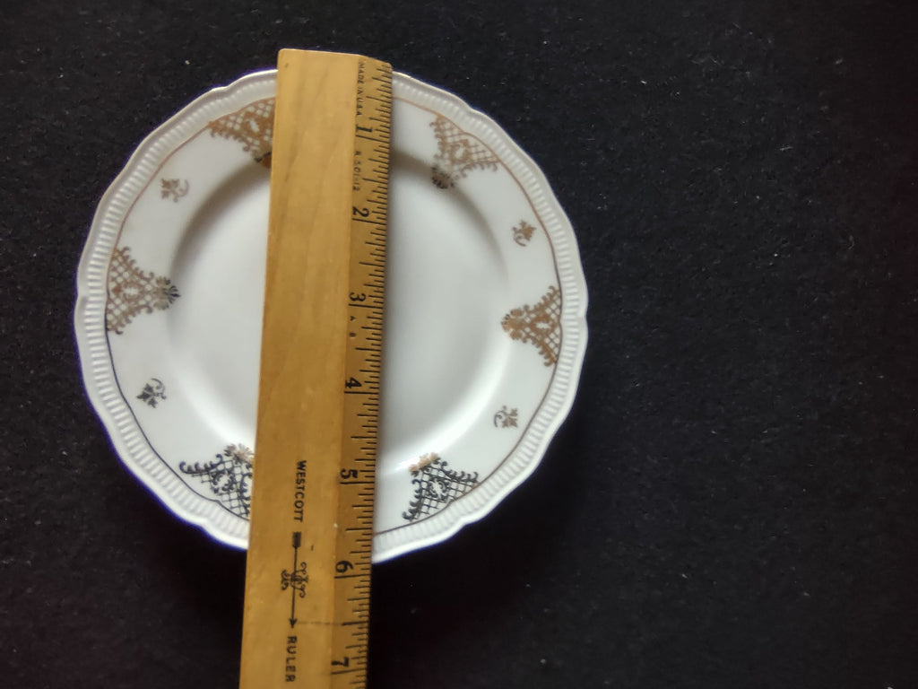 Seltmann Weiden Renate plate with ruler showing approximately 6.5 inch diameter on dark background